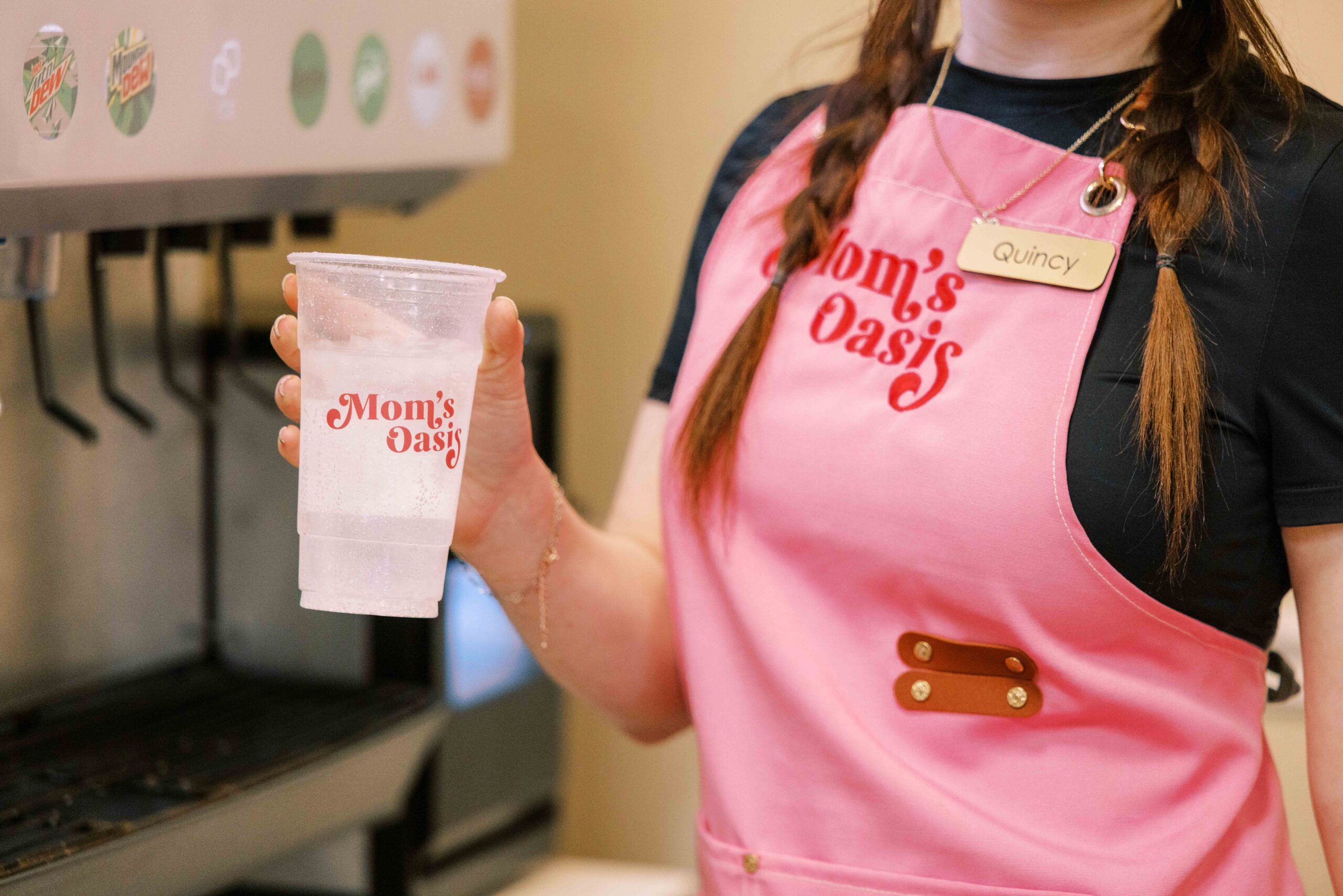 Mom’s Oasis employee holding a dirty soda in American Fork, Utah