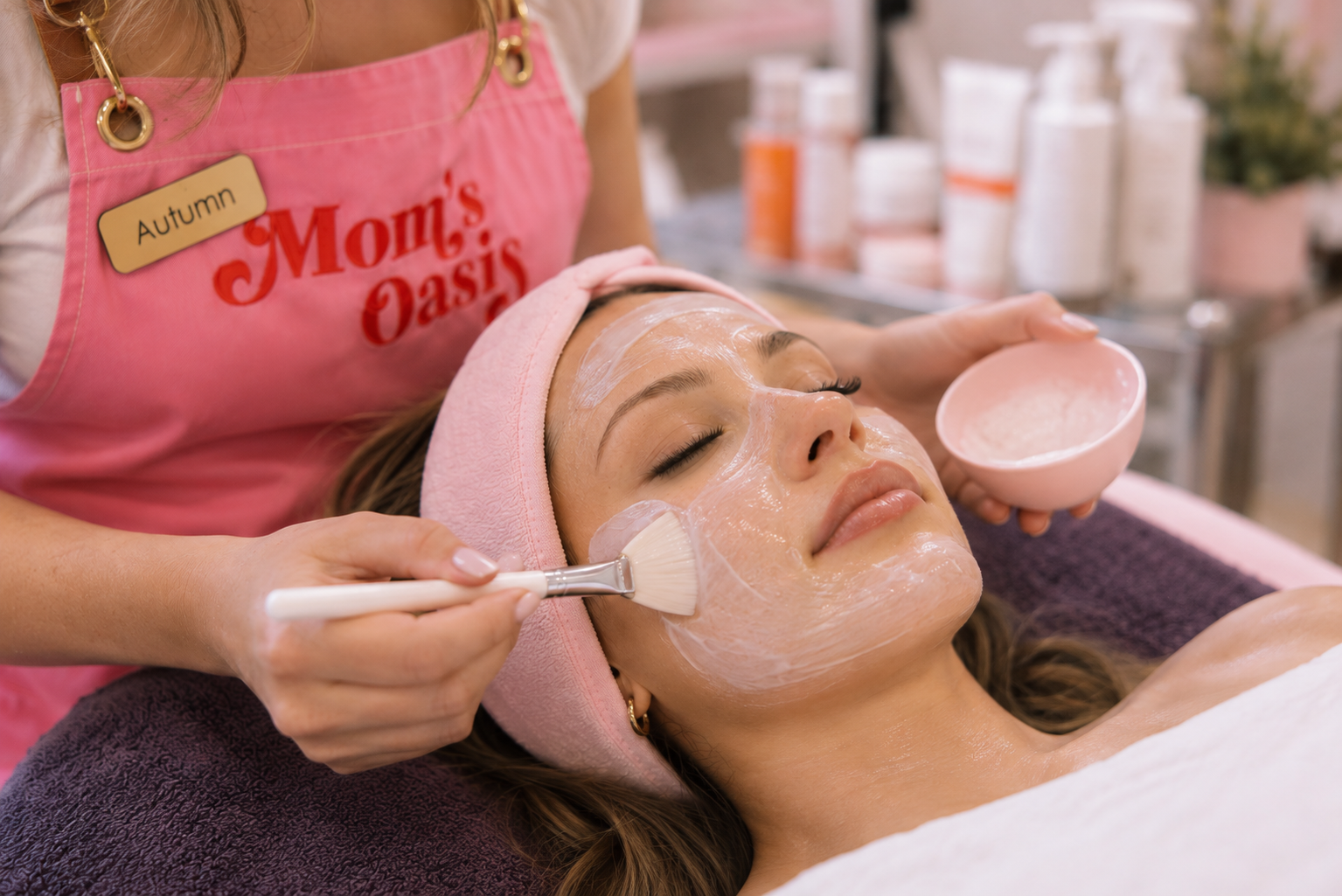 Woman receiving a hydrating facial mask treatment at Mom’s Oasis spa in American Fork, Utah