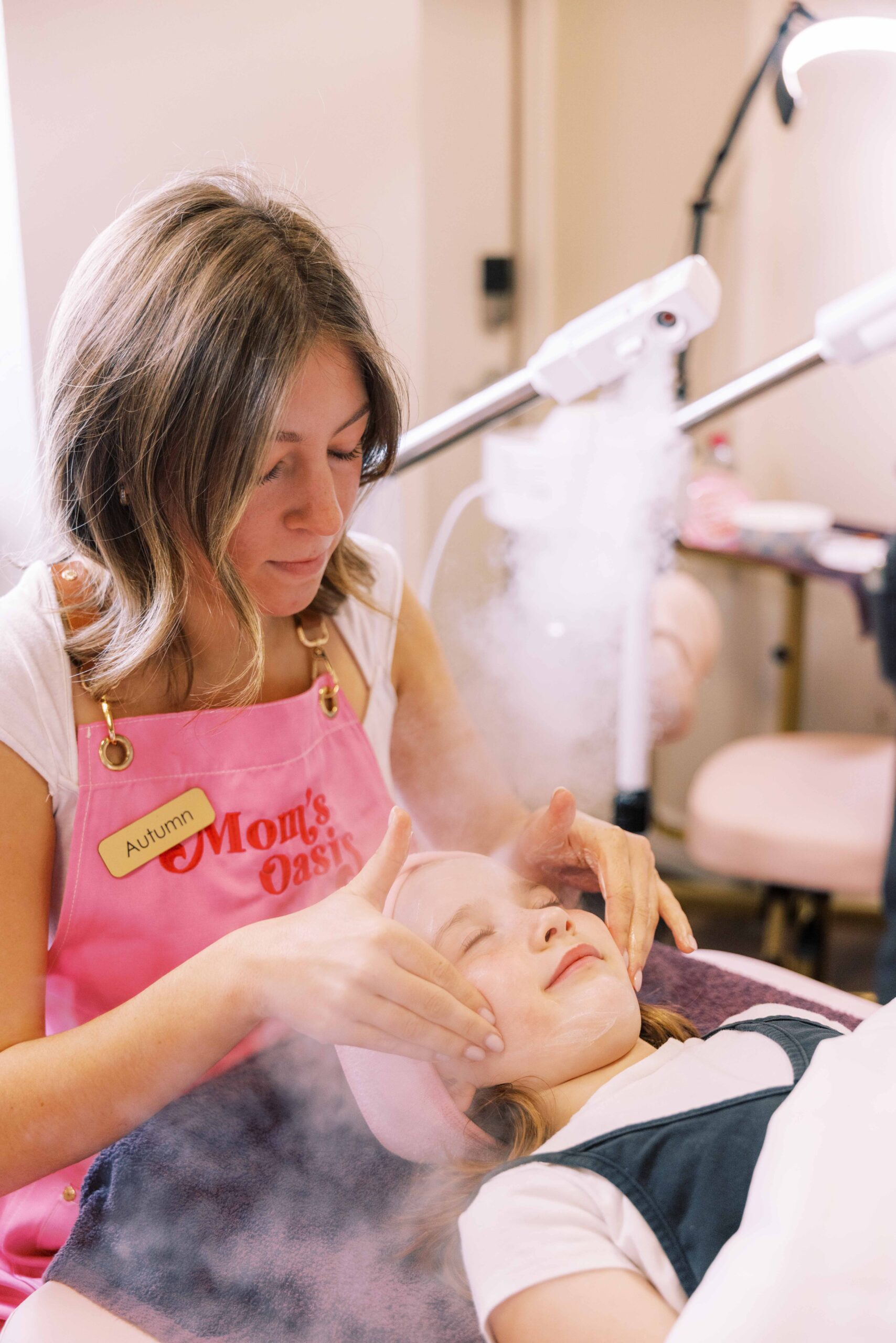 Woman enjoying a relaxing facial at Mom’s Oasis spa in American Fork, Utah